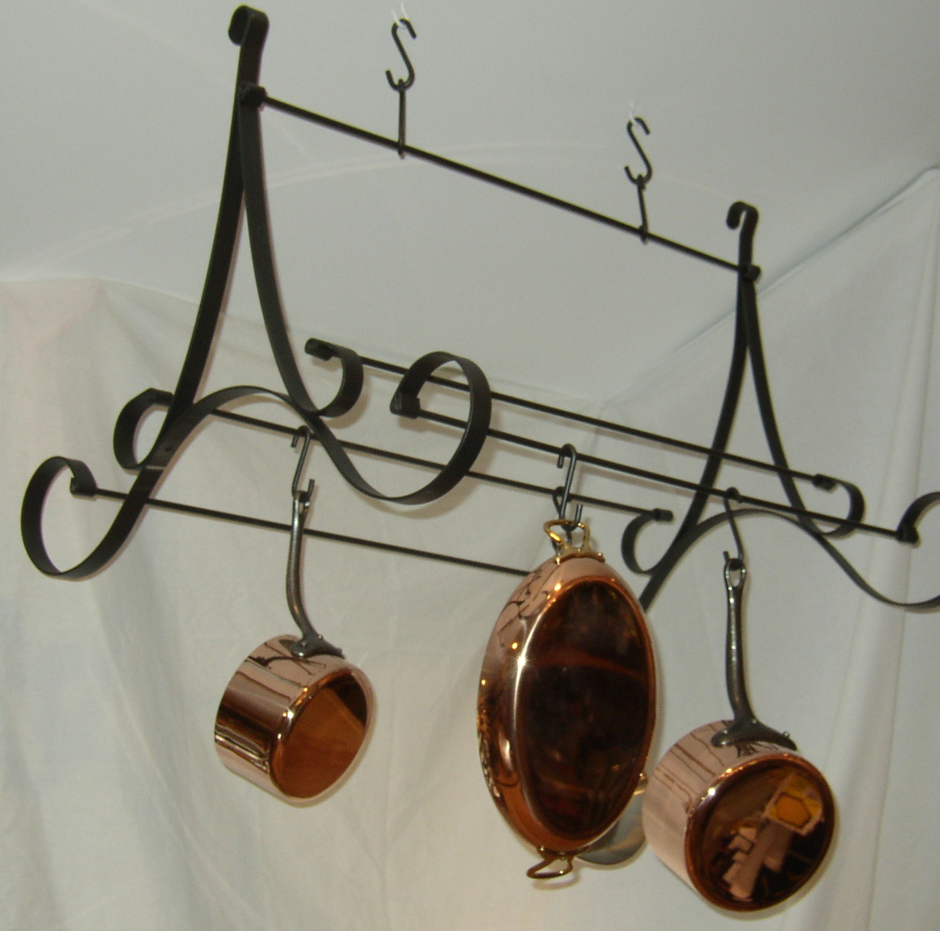 Functional and decorative pot racks to display and store cookware.